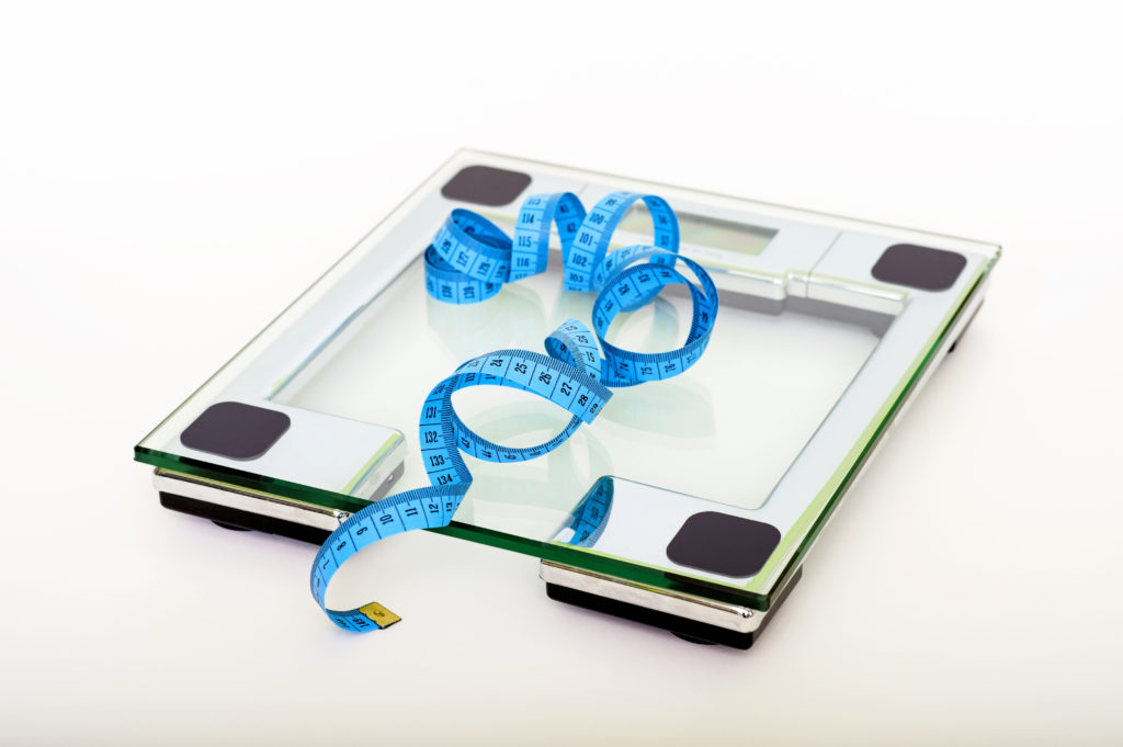 Canva - Blue Tape Measuring on Clear Glass Square Weighing Scale